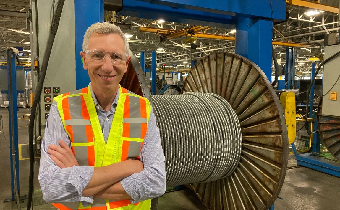 Jerome Leroy standing in front of a cable reel